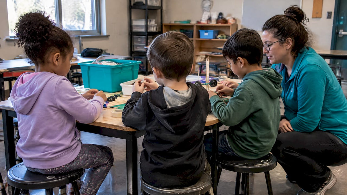 Mentor guiding hands-on afterschool STEM activity