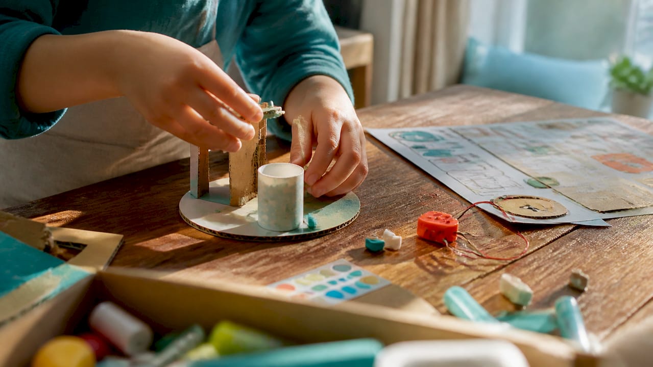 Child building hands-on STEAM kit